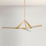 Jonas chandelier shown in a mid-room angled view with neutral background