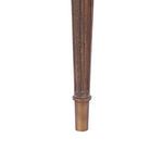 Detail of fluted tapered leg ending in a brass ferrule on Vienna Bench