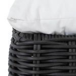 Close-up of cushion edge layered on woven base focusing on fabric and weave detail