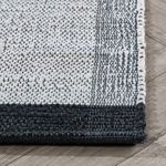 Side angle highlighting tight weave edge with black border and fringe stitching