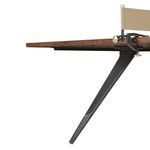 Side profile of angled black cast iron leg supporting the oak table top