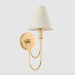Side view of Warrensburg Wall Sconce showing elongated curved arm and circular mounting plate