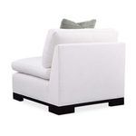 Rear angle highlighting solid white back and side panels with visible seams and cushion backs