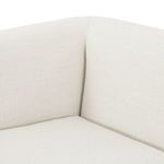 Close-up of sofa corner showing crisply stitched seams and smooth fabric texture