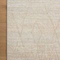 Top corner of Kamala rug on wooden floor showcasing edge detail and pattern alignment