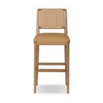 Warm wood frame bar stool with woven natural fiber back and soft tan upholstered seat