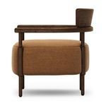 Side view highlighting curved backrest and profile of cushioned seat in ochre linen