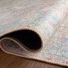 Close-up side view of rug rolled to highlight soft texture and flexible construction