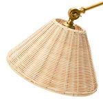 Close-up of rattan shade texture and brass shade attachment details