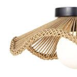 Close-up on braided edging and twisted rope texture around white glass globe of ceiling flush mount