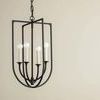 Kael Lantern hanging against beige wall, showing full front view with chain