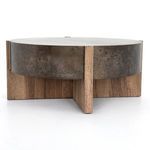 Close-up of junction between distressed iron top and solid oak base
