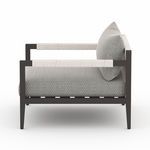 Side profile highlighting rope-wrapped armrests and thick seat cushion on Sherwood Faye chair