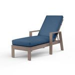 Laguna Chaise Lounge with hand-brushed aluminum frame mimicking driftwood and blue cushioned seat with backrest