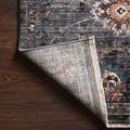 Samra rug corner flipped to reveal backing texture and weave detail with fringe edges