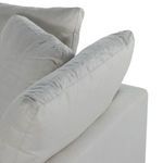 Close-up of cushioned backrest showing feather-blend softness and uniform light upholstery
