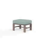 Laguna Ottoman with hand-brushed aluminum frame mimicking driftwood and light blue cushioned top