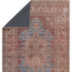 Back corner folded over showing solid dark gray backing fabric and front medallion print
