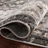Curled corner close-up of Estelle rug showing dense polypropylene and polyester pile