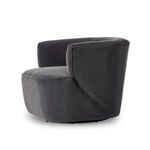 Close-up of chair’s armrest and adjacent cushion highlighting fabric and seams