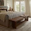 Polly rug in bedroom from low angle showing texture and scale with bench at foot of bed