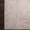 Close view of Loren Sand Rug corner on dark wood floor showing delicate vintage pattern and texture