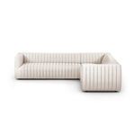 Front view of the L sectional showing channel-tufted back and arms with crisp linen texture