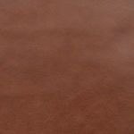 Close-up of the brown leather cushion texture on Fayth Bar + Counter Stool
