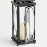 Front corner view with lantern door open, showing interior candle and hinge detail