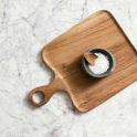 Valley Nature Bowl with salt and wooden spoon on square wooden cutting board on marble surface