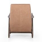 Side profile of warm brown leather recliner with footrest fully extended
