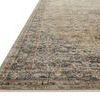 Close-up angled view showing low pile and subtle blue and beige border details of the Heritage Sage Navy rug