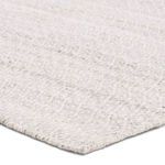 Close-up of soft recycled plastic fibers showing texture and weave detail of trellis pattern