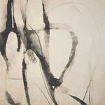 Close-up detail of black brushstrokes and subtle texture on beige background