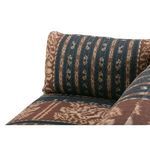 Close-up of angled side arm cushion illustrating thick fabric and pattern detail