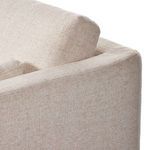 Clean side view highlighting Toland sectional's smooth bordered armrest and fitted cushions