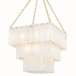 Chandelier glowing warmly when lit, emphasizing alabaster translucency and soft ambient light