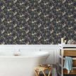 Birdsong wallpaper applied as accent wall behind freestanding bathtub in a bathroom with white wainscoting and natural woo...