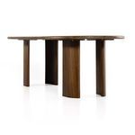 Underside view showing four arched legs and book-matched veneer detail on tabletop