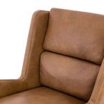 Zoom on upper segmented backrest cushions with visible seams and leather texture