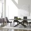 Industry Rectangle Dining Table styled in a bright dining room with black chairs and modern rug