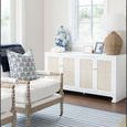 Sofia Cabinet against wall with window, decorated with blue and white vase, decor, and woven lamp
