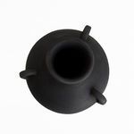 Top-down view showing wide hollow opening and three loop handles of black terracotta vase