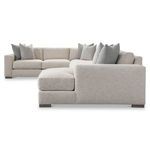 Side view showing plush cushions and the texture of the neutral fabric on the sectional