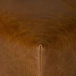 Close-up on the front corner seam displaying precise leather stitching and smooth finish