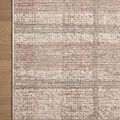 Flat lay corner of Ember Clay / Mist rug on hardwood floor showing edge detail and color variation