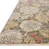 Low angle side view showing the rug's thin profile and fringed edge
