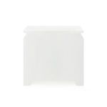 Side view of Elina side table highlighting smooth white finish and contoured edges