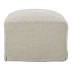 Back view of slipcover ottoman revealing neat fabric seams and skirt slit detail