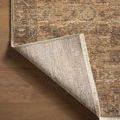 Rug corner flipped to reveal tightly woven natural back with overlocked edge